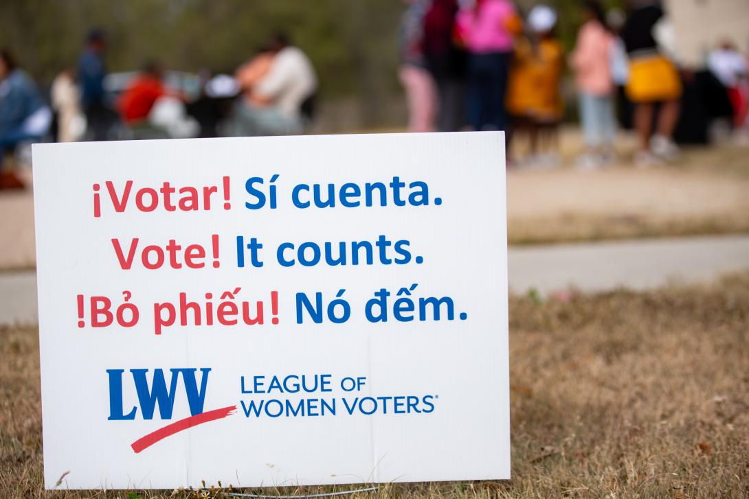 League of Women Voters yard sign featuring the word "vote" in several languages